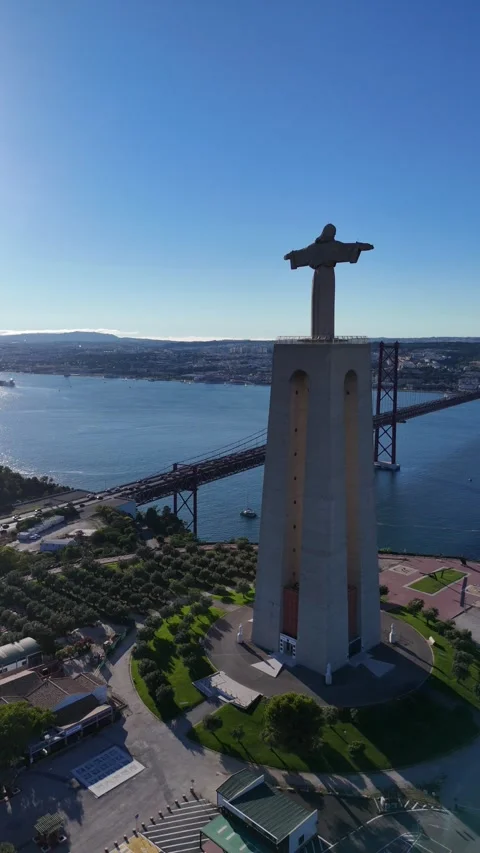 Vertical Drone View of Cristo Rei Statue and 25 de Abril Bridge Lisbon Stock Footage 333673776