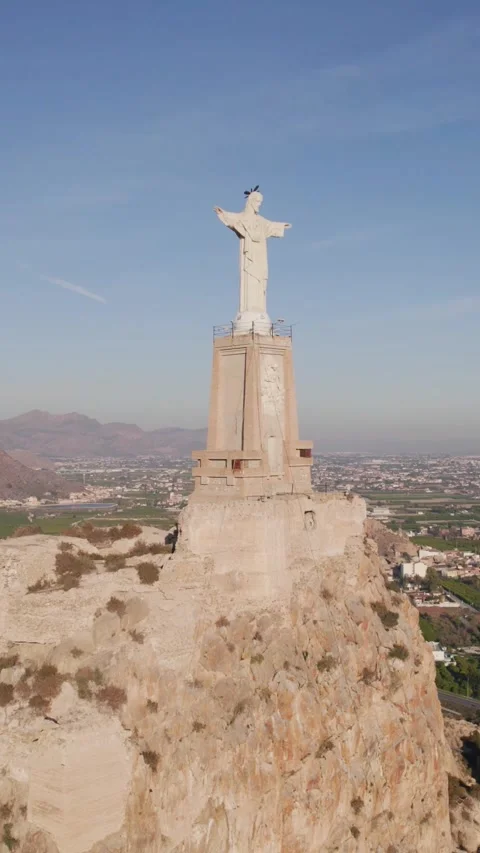 Vertical Drone View of Falcon Soaring Around Christ of Monteagudo, Murcia 動画素材 331598121