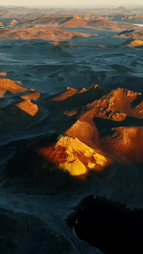 Vertical drone view of Iceland’s volcanic highlands with black ash dunes and Stock Footage 330902409