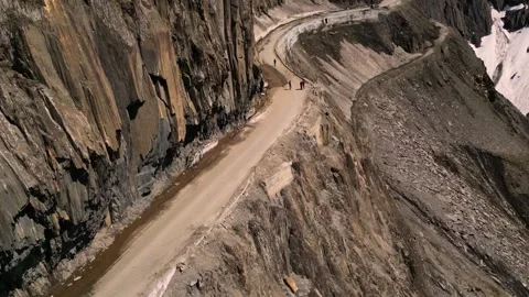 Vertical drone view of a majestic yet risky mountain crossing. Stock Footage 310806704
