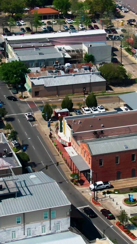 Vertical Drone View Over E Main Street Highlighting Downtown Life, Theatre, and Stock Footage 319992931