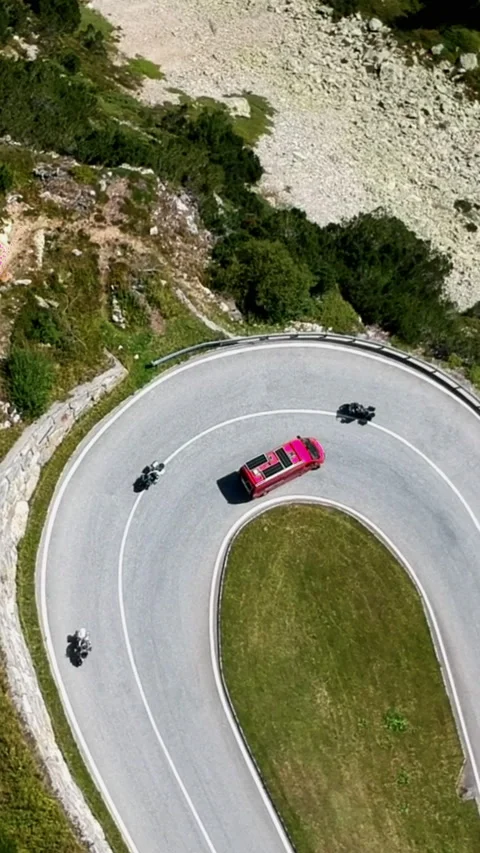 Vertical Drone View of Red Van on Winding Swiss Mountain Road Stock Footage 312266453