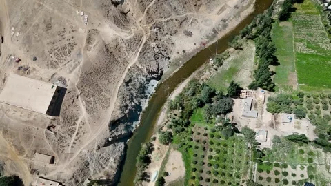 Vertical Drone View of River and Orchards in Ghorband Valley Afghanistan Vidéo 319078327