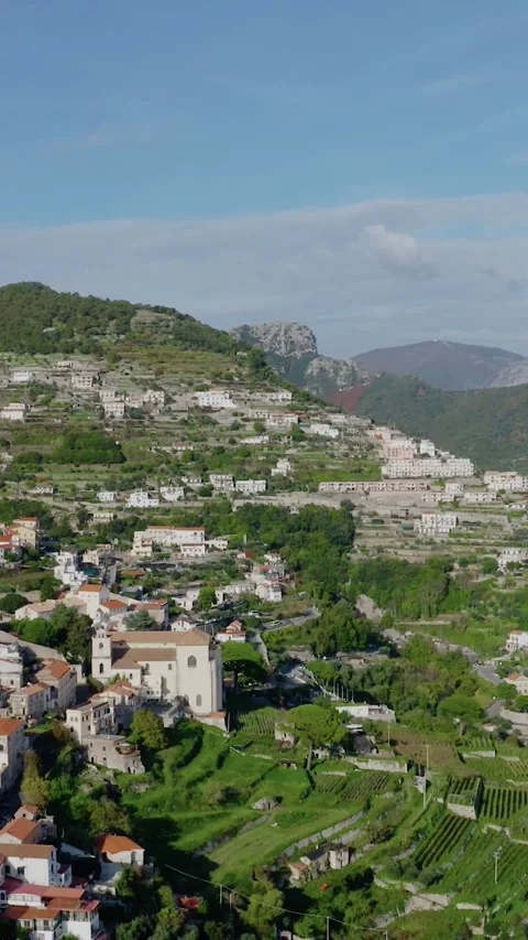 Vertical Drone View of Scenic Mountain Village with Terraced Hillside Homes 스톡 동영상 331117960