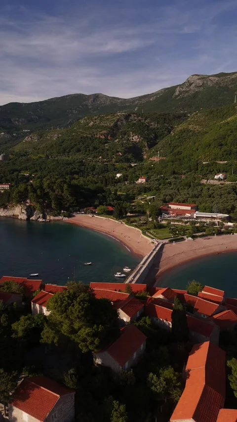 Vertical Drone View of Sveti Stefan Island Resort and Cliffs, 4K Stock Footage 337179579