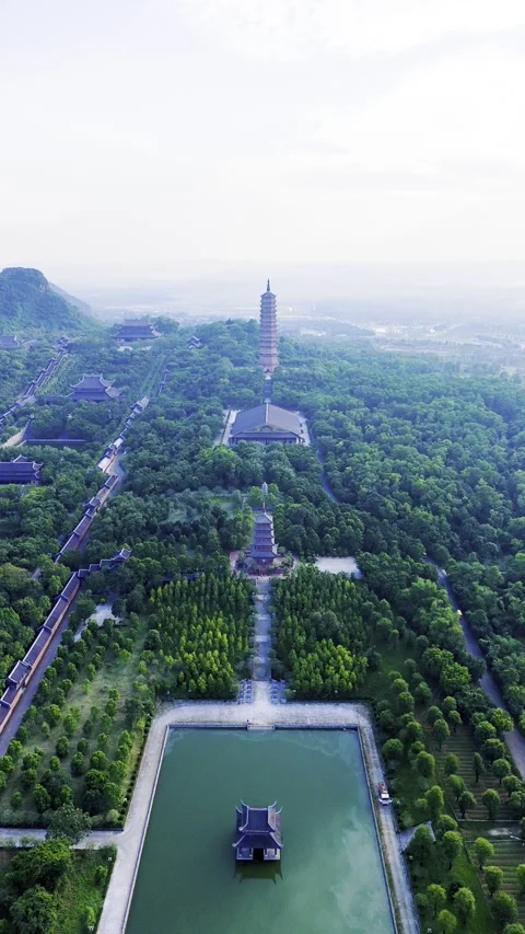 Vertical drone view of three aligned temples at Bai Dinh Pagoda, Vietnam – 4K Stock Footage 325040465