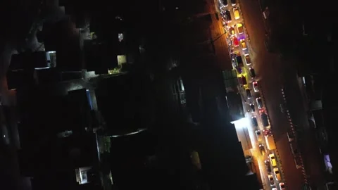 Vertical Drone View of Traffic Stopped for Passing Train at Night Stock Footage 309993999