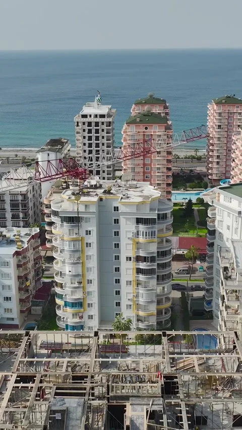 Vertical Drone View Urban Construction Zone with Materials and Workers in Action Stock Footage 341730725