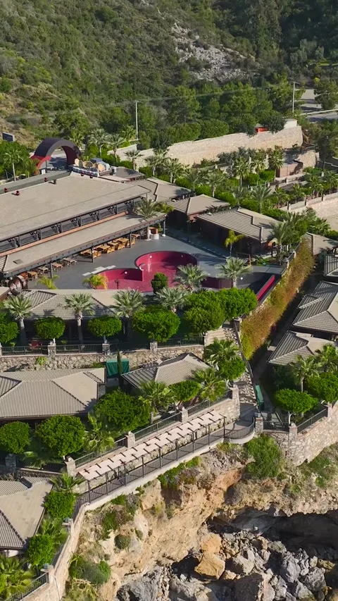 Vertical Drone View Villas and Resort Complex with Scenic Mountain Background 库存影片 341704647