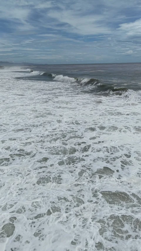 Vertical drone view of a white storm foam sea, Pacific near Acapulco Video stock 348256078