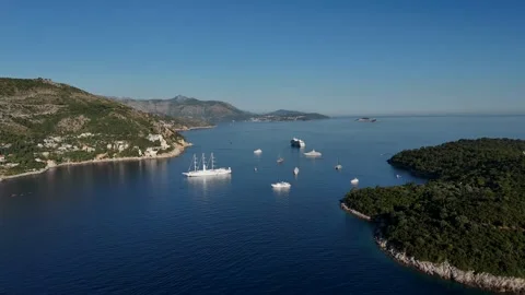 Vertical drone view of yachts and a cruise ship in blue Adriatic Sea Stock-Footage 345118429