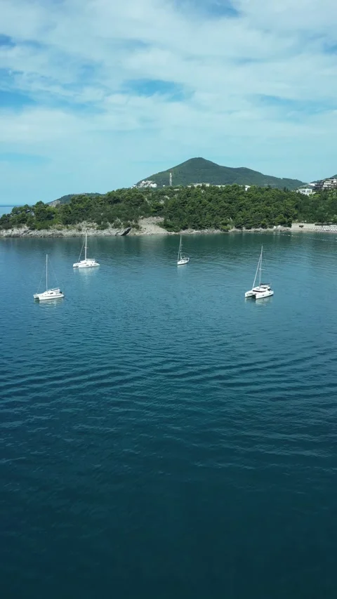 Vertical drone view of yachts near Becici Beach, Montenegro Stock Footage 338027051