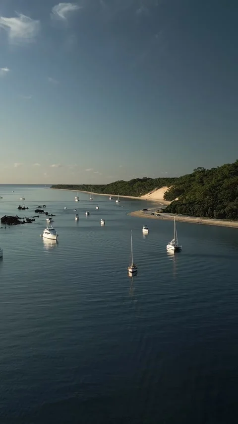 Vertical drone wide wrapping shot Tangalooma Wrecks yachts beach Moreton Island 스톡 동영상 328226759