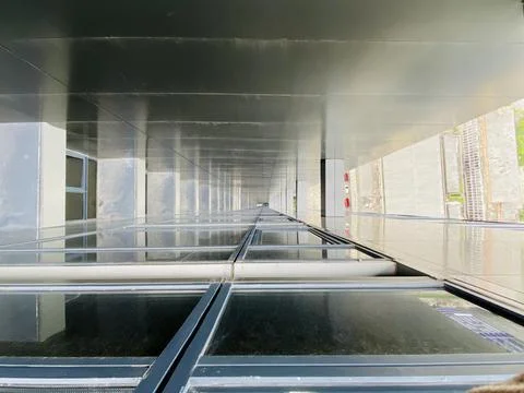 Vertical drop between building coloums Stock Photos