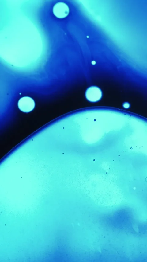 Vertical drop bubble paint spot water neon liquid Stock Footage 330515642