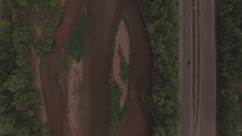 Vertical Drop Down to River Stock Footage 98847357