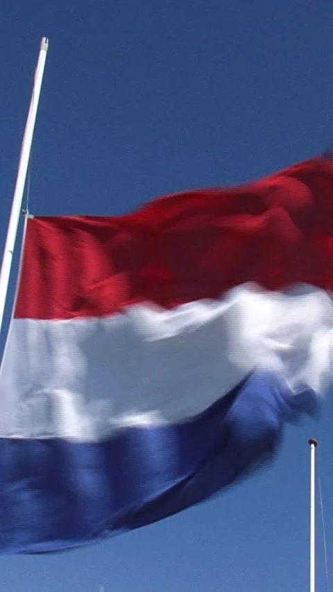 Vertical - Dutch flag at half-mast in strong wind Stock Footage 318078692