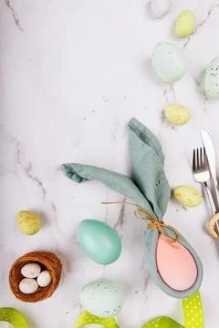 Vertical Easter Scene with Pastel Eggs and Napkin Bunny Stock Photos