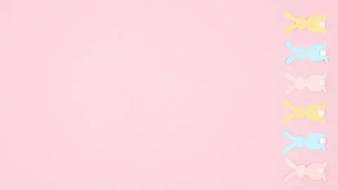 Vertical Easter stop motion animation with pastel colored bunnies appear 스톡 동영상 233228590