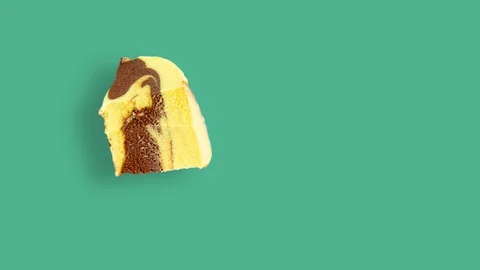 Vertical eating cream cake on mint background. Looped stop motion animation. Stock Footage 129694364