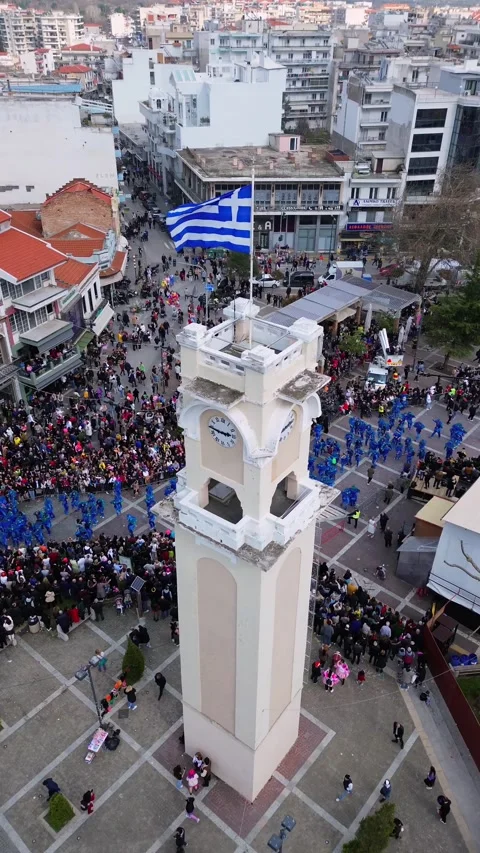 Vertical Editorial Aerial of Xanthi Clock Tower and Carnival Parade, Greece 스톡 동영상 332771863