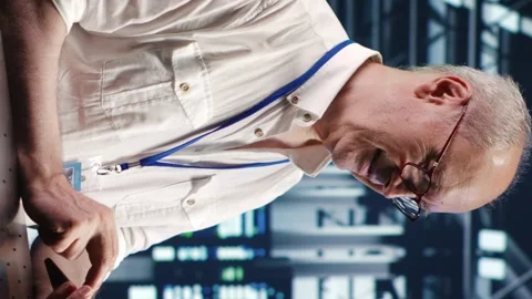 Vertical Employee running code in data center Stock Footage 247796637