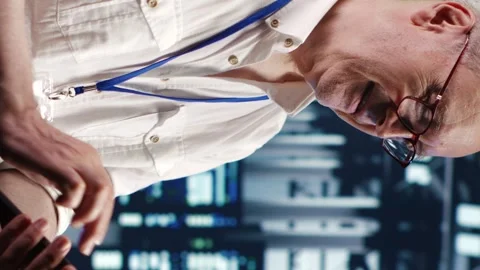 Vertical Engineer running code in data center Stock Footage 248471435