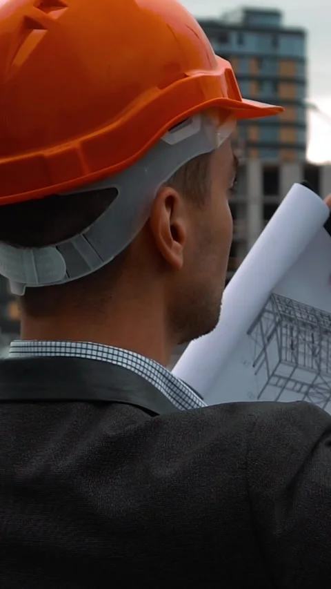 Vertical of Engineer with the smart phone taking pictures of construction Stock Footage 305507785