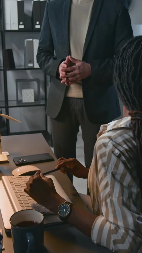 Vertical of Engineering Team Discussing Project by Computer Stock Footage 307993913