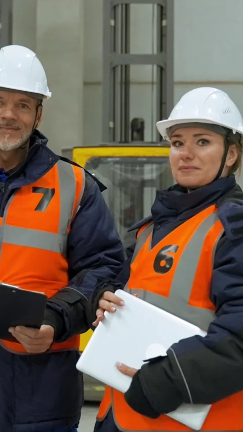 Vertical of Engineers in professional uniform stand in storage terminal Stock Footage 275624165