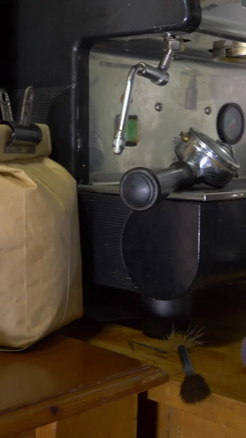 Vertical – Espresso coffee making equipment and a pack of beans. Video stock 283464605