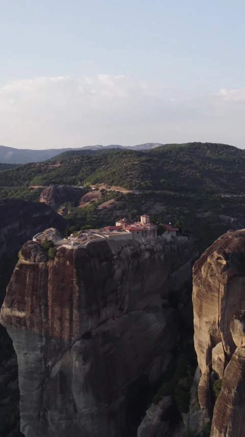 Vertical Establishing Drone Shot of Monastery on Cliff, Greece Stock Footage 322212343