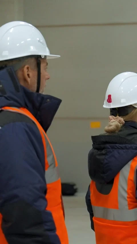 Vertical of Experienced engineers check operation of machinery equipment Stock Footage 275620412