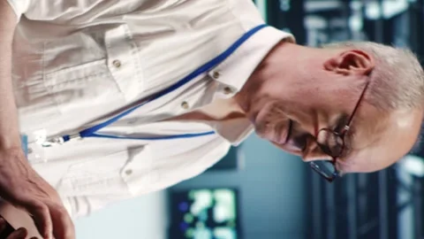Vertical Expert running code in data center Stock Footage 247797678