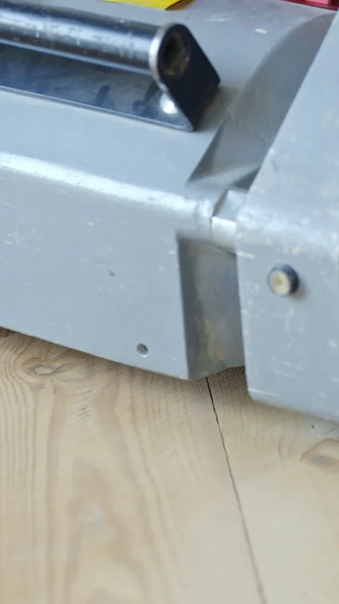 Vertical extreme close-up of floor sander revealing sharp contrast between Stock Footage 310588523
