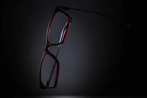 Vertical eyeglasses on gradient dark background Stock Photos