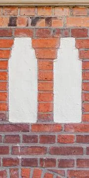 Vertical Faade Detail with Two Plaster Inlays and Brick Bands 写真素材