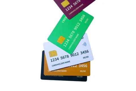 Vertical falling cascade of multi-colored credit and debit cards on a white.. Stock Photos