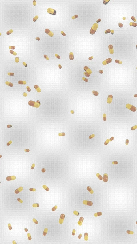 Vertical Falling Gold Capsule Pills Supplement 4K Loop Alpha Video stock 333676127
