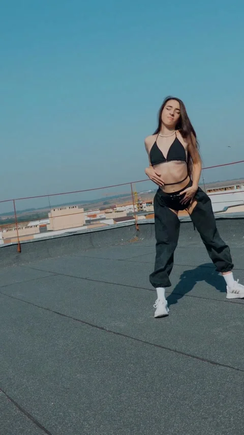 Vertical Fashion Model Dancing Sensually On Rooftop In Summer Sunshine. Stock Footage 342223437