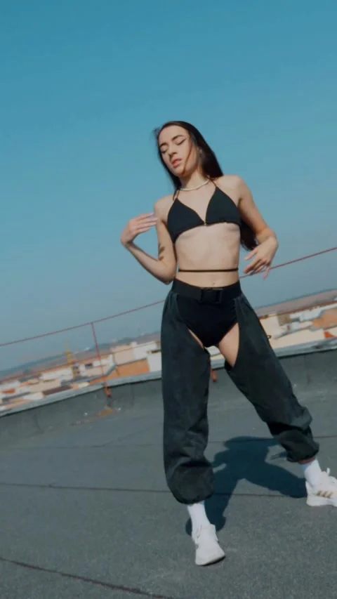 Vertical Fashion Model Dancing Sensually On Rooftop In Summer Sunshine. Stock Footage 342223458