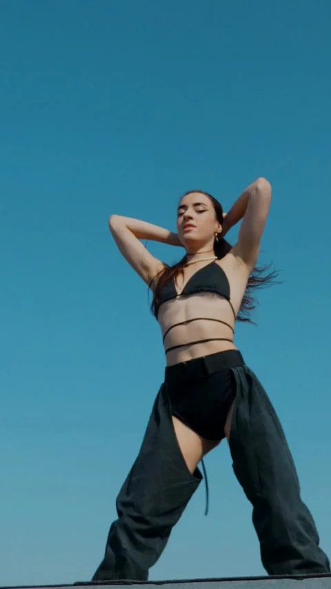 Vertical Fashion Model Dancing Sensually On Rooftop In Summer Sunshine. Stock Footage 342223469