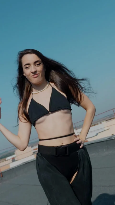 Vertical Fashion Model Dancing Sensually On Rooftop In Summer Sunshine. Stock Footage 342223496