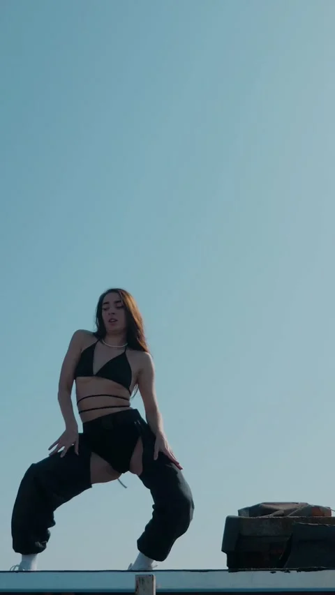 Vertical Fashion Model Dancing Sensually On Rooftop In Summer Sunshine. Stock Footage 342223507