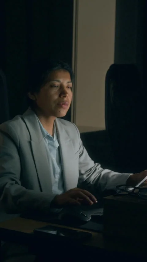 Vertical of Female Employee Typing on Computer in Middle of Night in Office Stock Footage 331871952