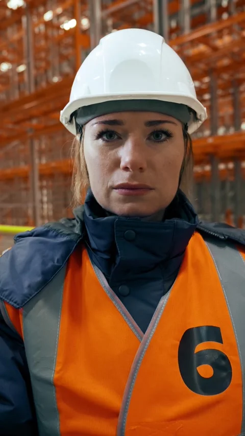 Vertical of Female engineer listens to interviewer waving head to agree Stock Footage 275624000