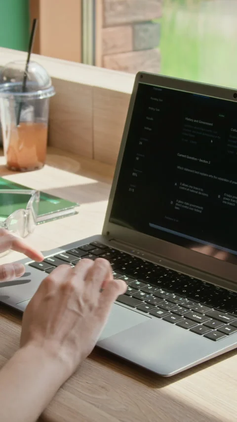 Vertical of Female Hands Typing on Laptop and Taking Online Education Test Stock Footage 342111286