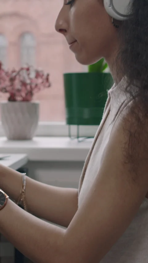 Vertical of Female Programmer Sitting on Fit Ball and Coding on Computer Stock Footage 275031274