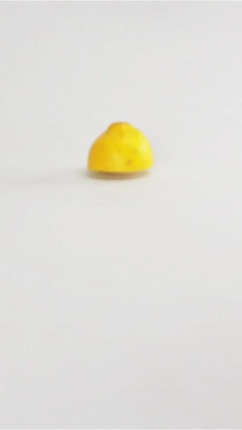 Vertical of Few lemons halves lobules of lemon falling at the table Stock Footage 305516463