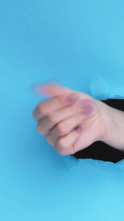 Vertical finger snap easy gesture hand torn paper Stock Footage 246232514